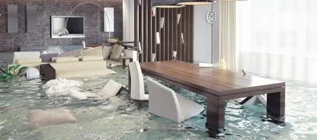 Flooded modern living room with furniture surrounded by water and debris