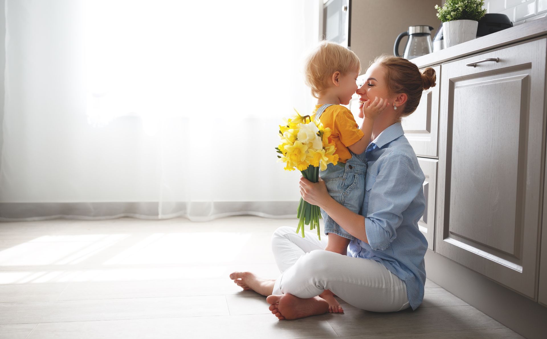 Woman holding baby thinking about probating a will. Stock photo representing potential client of bob leonard law group.