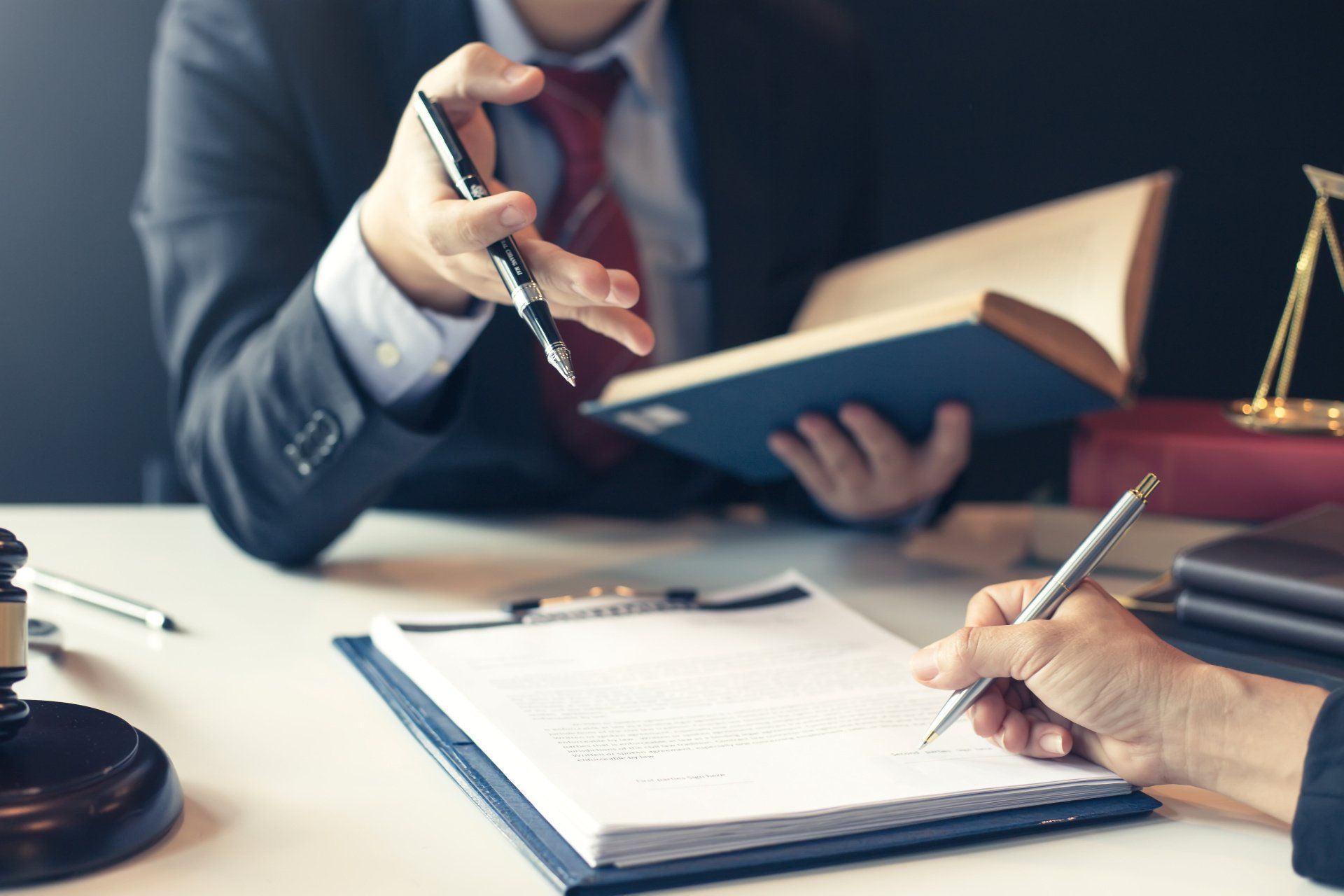 Bob Leonard explaining a Divorce document to client.