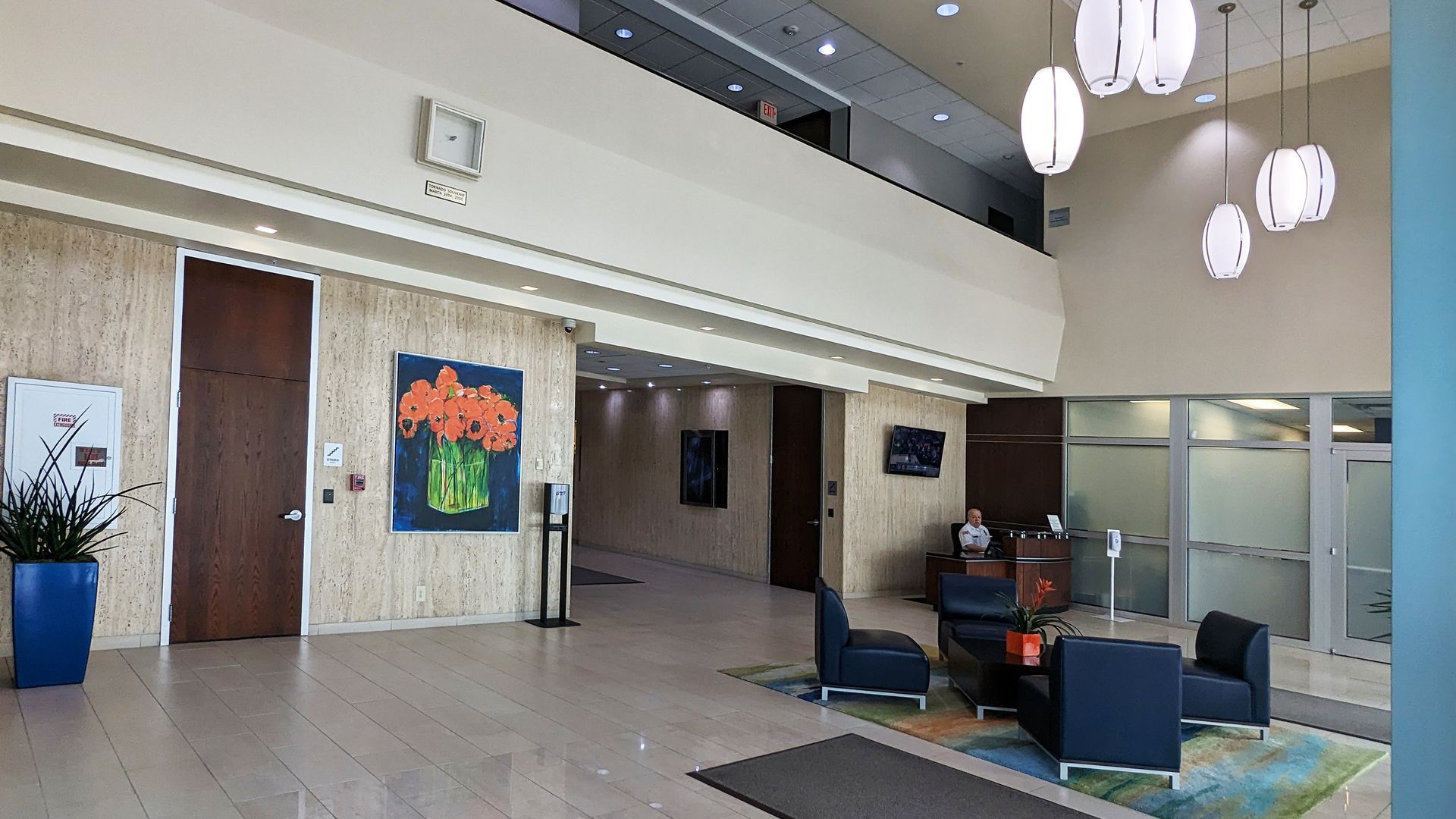 A large lobby with a clock on the wall