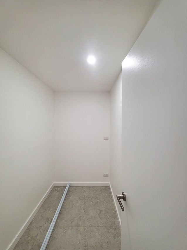 An Empty Room with White Walls — JWP Painting & Property Services in Ettalong Beach, NSW