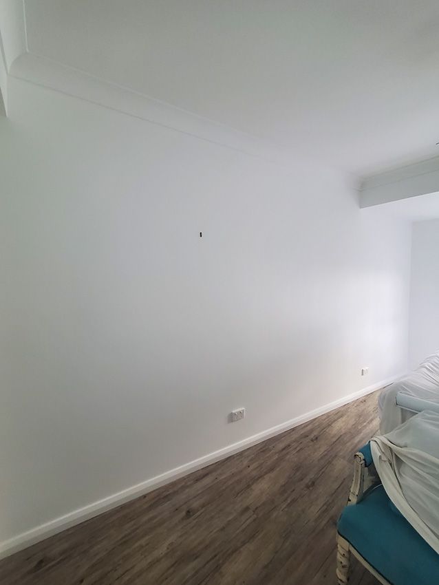 A Bedroom with White Walls — JWP Painting & Property Services in Ettalong Beach, NSW