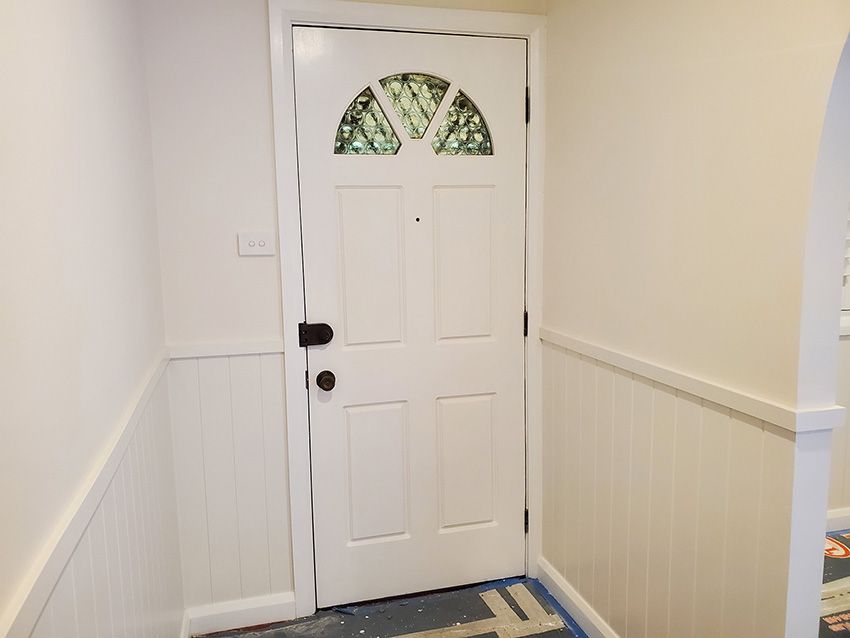 A White Door with a Stained-Glass Window — JWP Painting & Property Services in Lake Macquarie, NSW