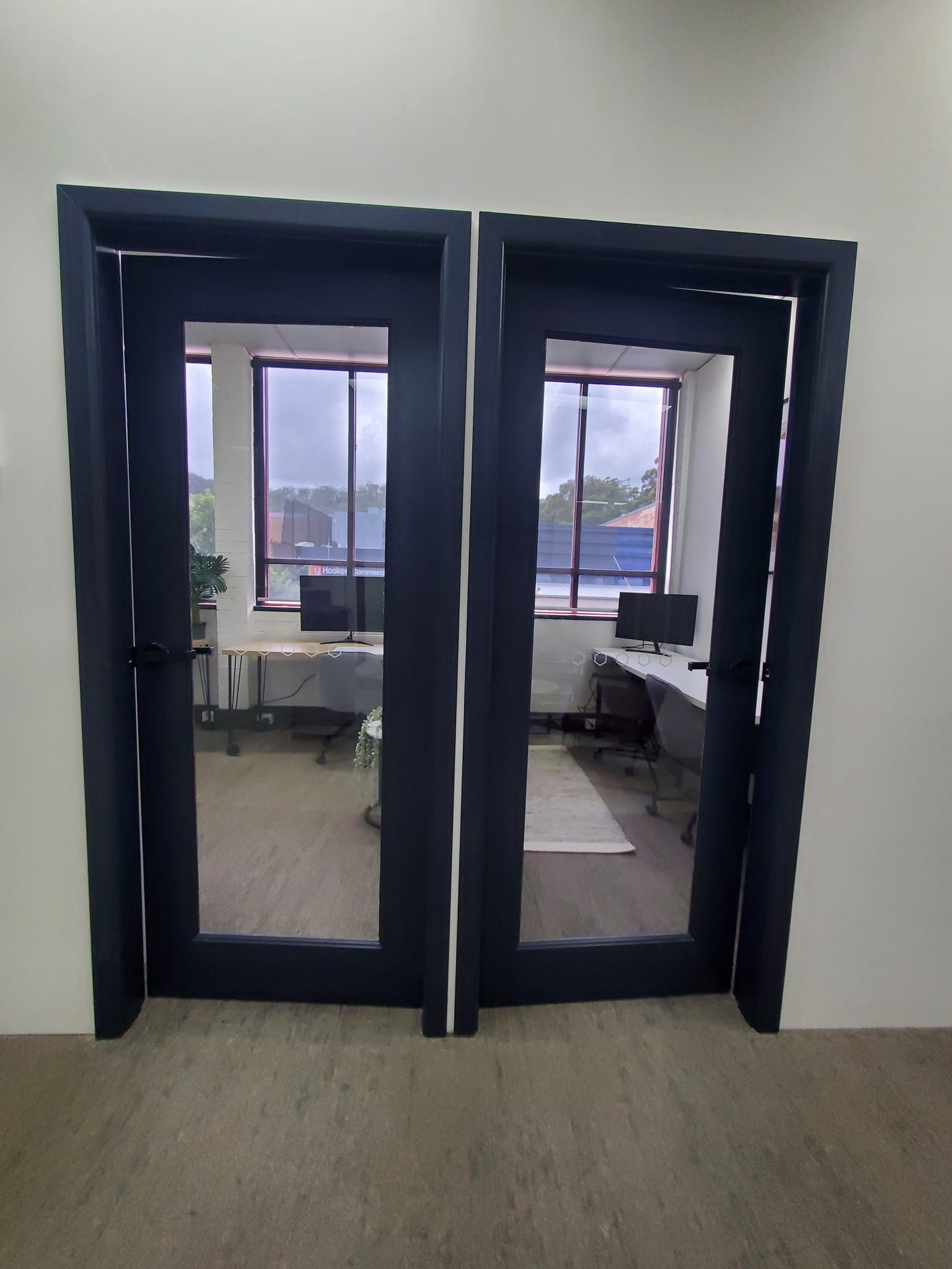 A Hallway with a Curved Wall and Wooden Floors — JWP Painting & Property Services in Ettalong Beach, NSW