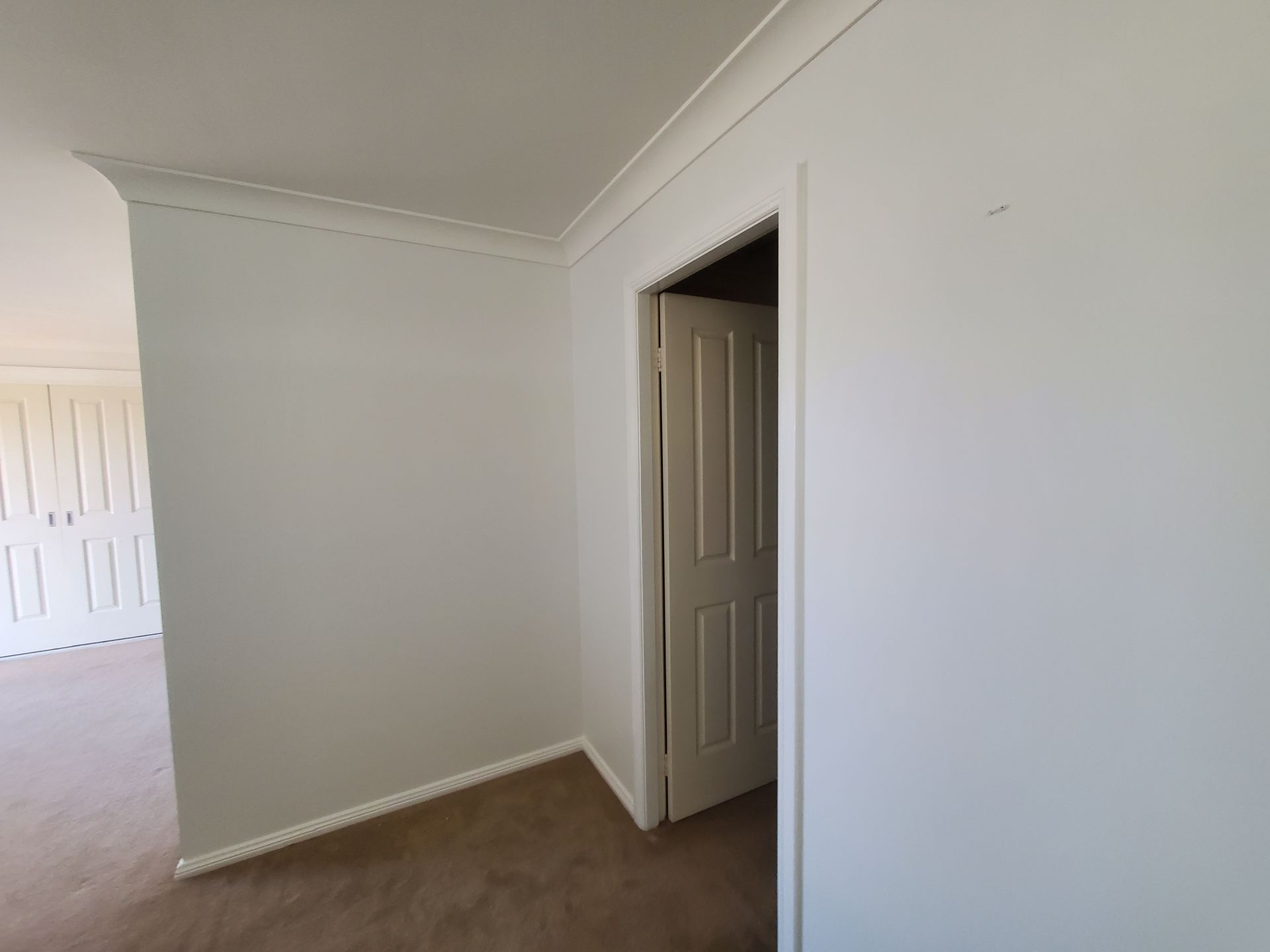 White Hallway With a Doorway — JWP Painting & Property Services in Ettalong Beach, NSW
