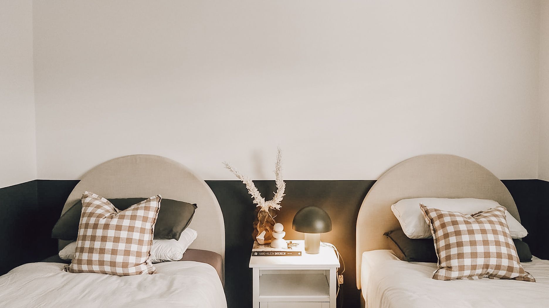 A Bedroom With Two Beds and a Nightstand — JWP Painting & Property Services in Ettalong Beach, NSW