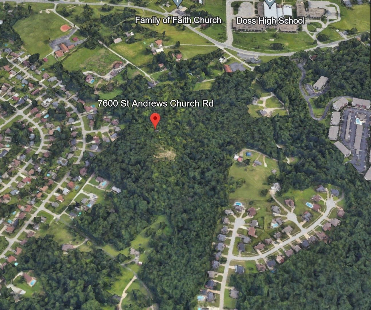 Aerial view of the area with a pin at 1500 St Andrews Church Rd, surrounded by houses, trees, and a high school.
