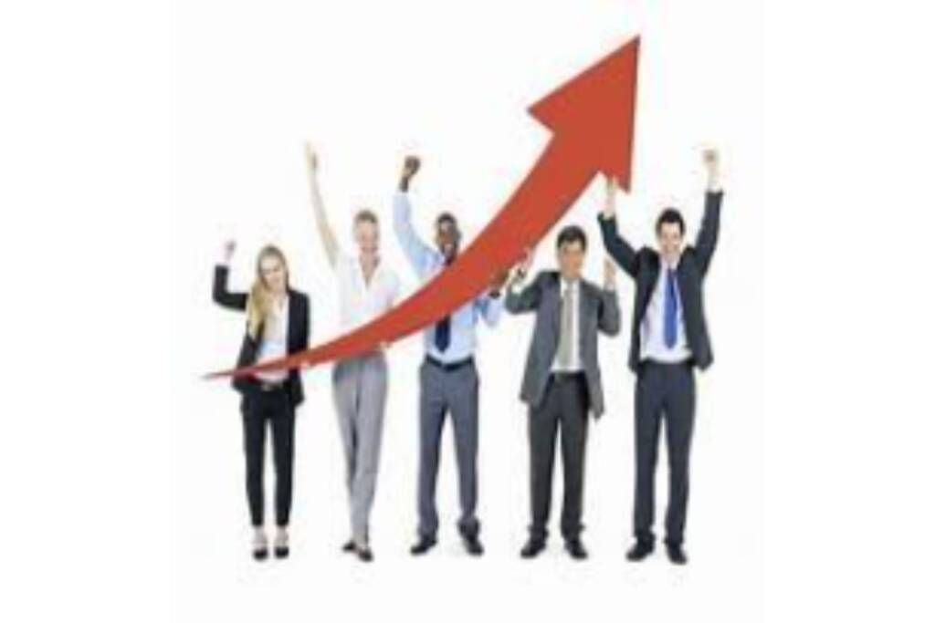 Five businesspeople cheering beside a red upward arrow, symbolizing growth and success