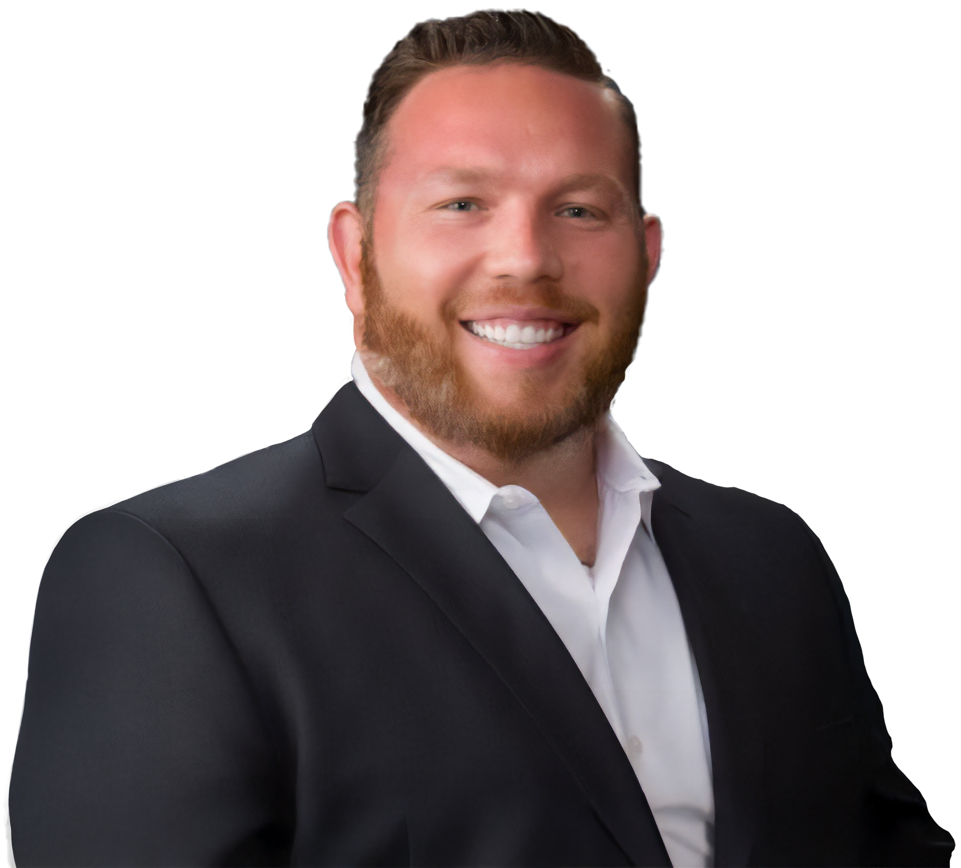 Man in a suit smiles, looking at the viewer. He has a beard and is against a white background.