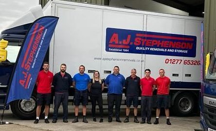 AJ Stephenson Removals team in front of their lorry