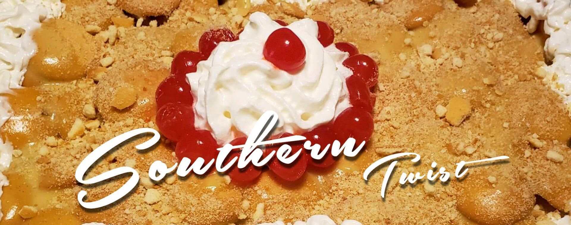a southern twist cake with whipped cream and cherries on top