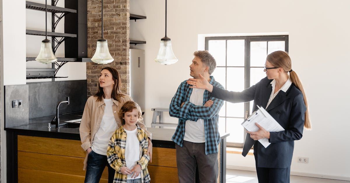 A family is looking at a house with a real estate agent.