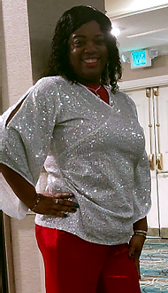 Picture of Agatha T, enjoying her new hearing aids.