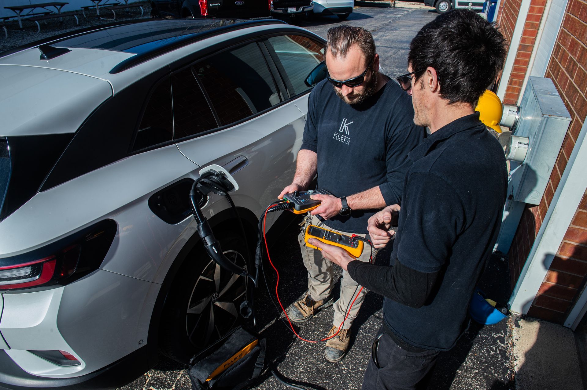 A person is charging an electric car with a charger.