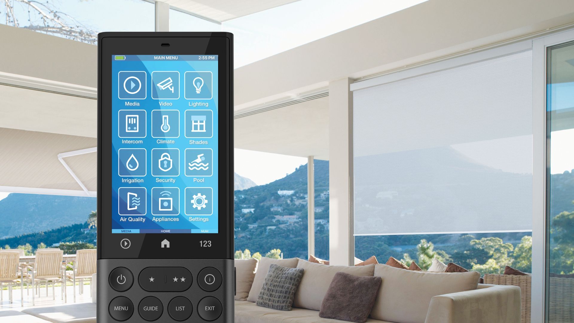 Remote control in foreground, blue smart-home interface over a bright living room and mountain view.