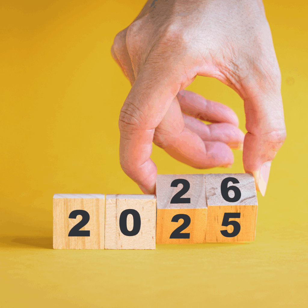 A Hand Flips a Wooden Block From 2025 to 2026 โ Michelle Crutcher Business Coaching & Consulting in The Entrance North, NSW