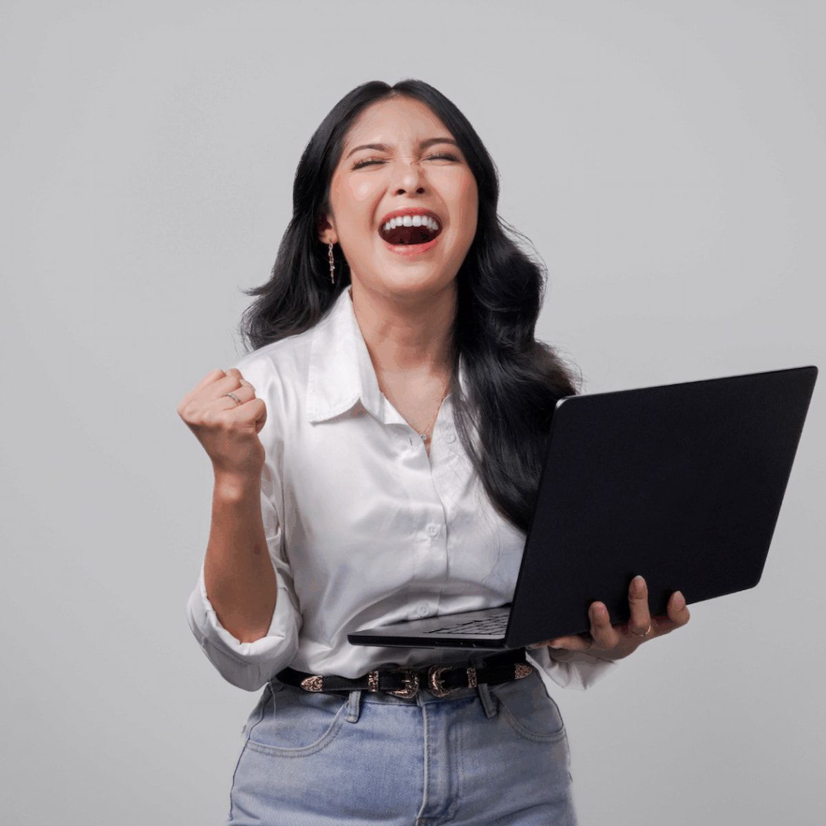 A Woman in a White Blouse and Jeans Celebrates β Michelle Crutcher Business Coaching & Consulting in The Entrance North, NSW