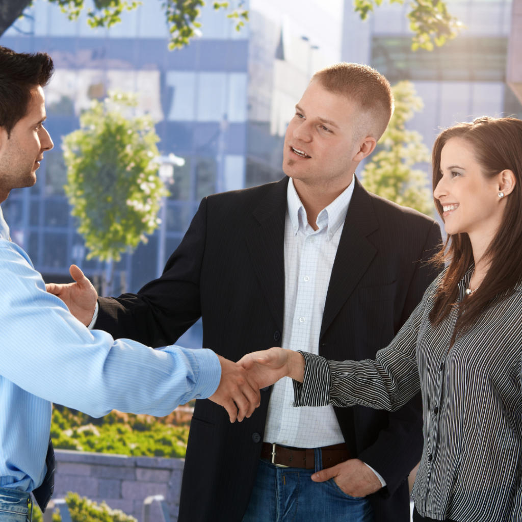 A Person in a Blue Shirt Shakes Hands — Michelle Crutcher Business Coaching & Consulting in The Entrance North, NSW