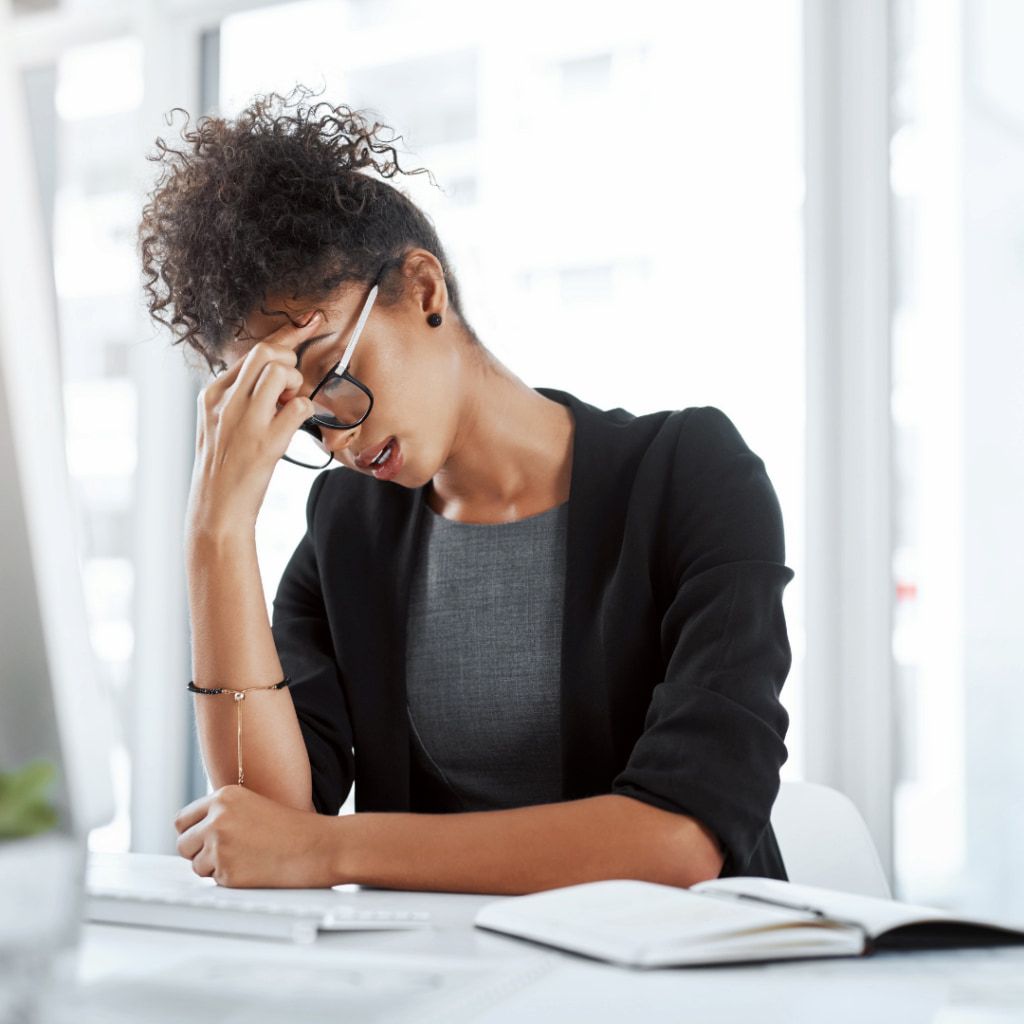 A Woman Sitting at a Desk — Michelle Crutcher Business Coaching & Consulting in The Entrance North, NSW