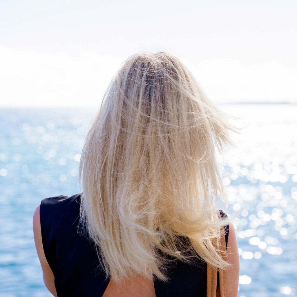 A Person With Blonde Hair Stands — Michelle Crutcher Business Coaching & Consulting in The Entrance North, NSW