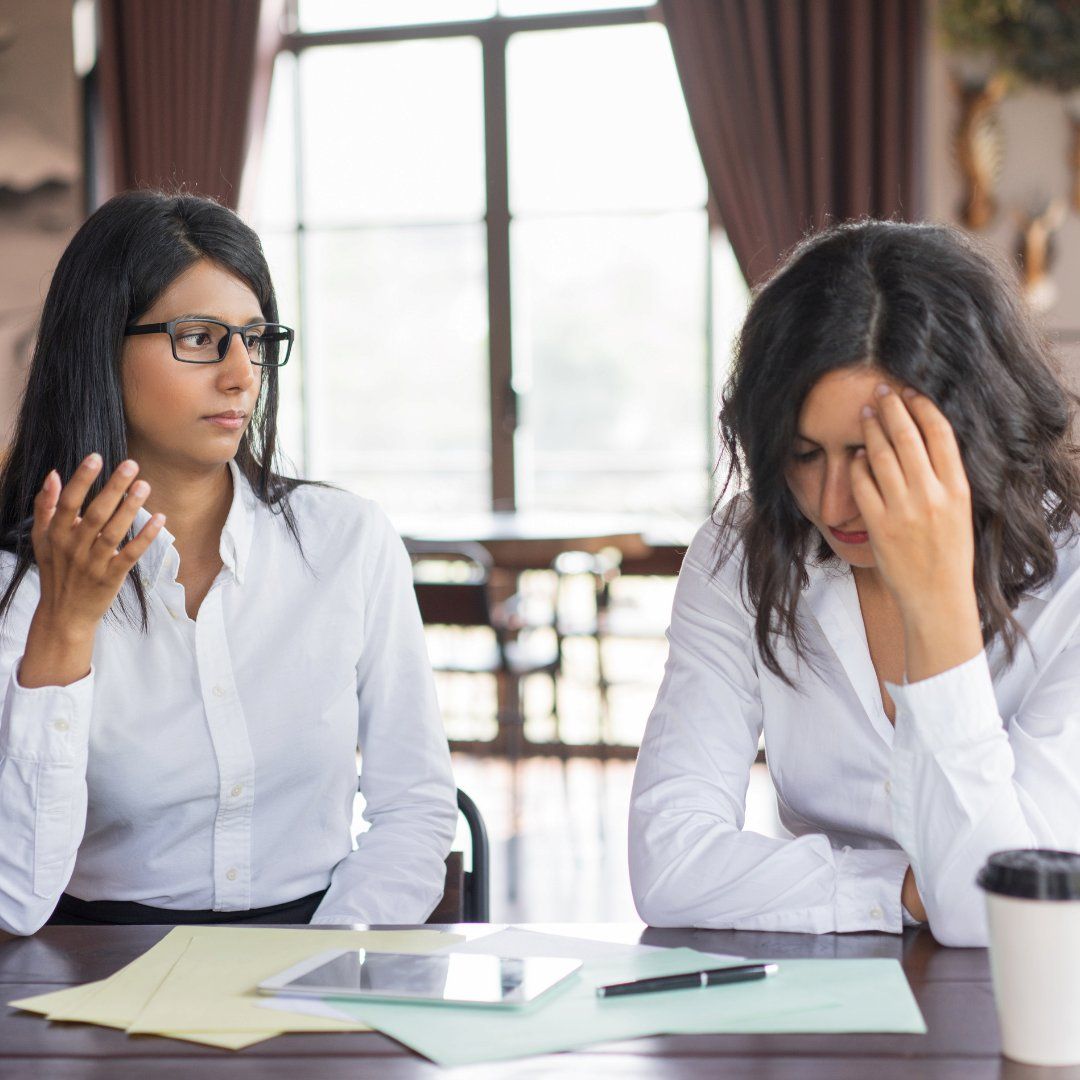 Two Women In A Discussion At A Table — Michelle Crutcher Business Coaching & Consulting in The Entrance North, NSW