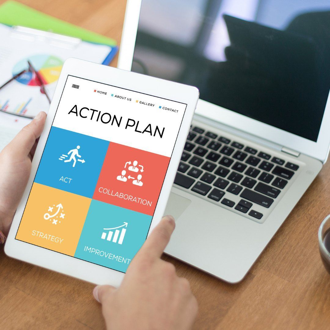 A Hand Holds A Tablet Displaying An Action Plan — Michelle Crutcher Business Coaching & Consulting in The Entrance North, NSW
