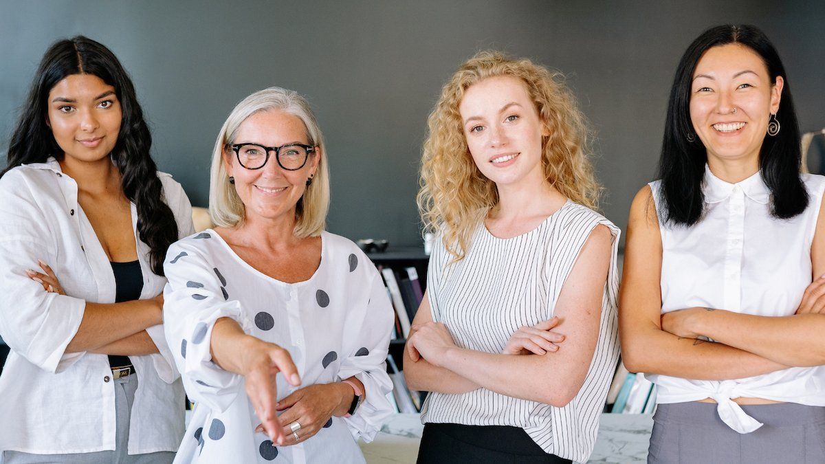 Four Women Stand Side By Side — Michelle Crutcher Business Coaching & Consulting in The Entrance North, NSW