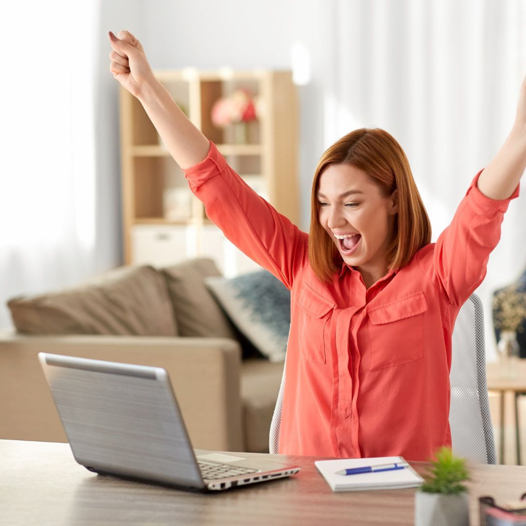 Excited Woman In A Red Shirt Raises Her Arms โ Michelle Crutcher Business Coaching & Consulting in The Entrance North, NSW