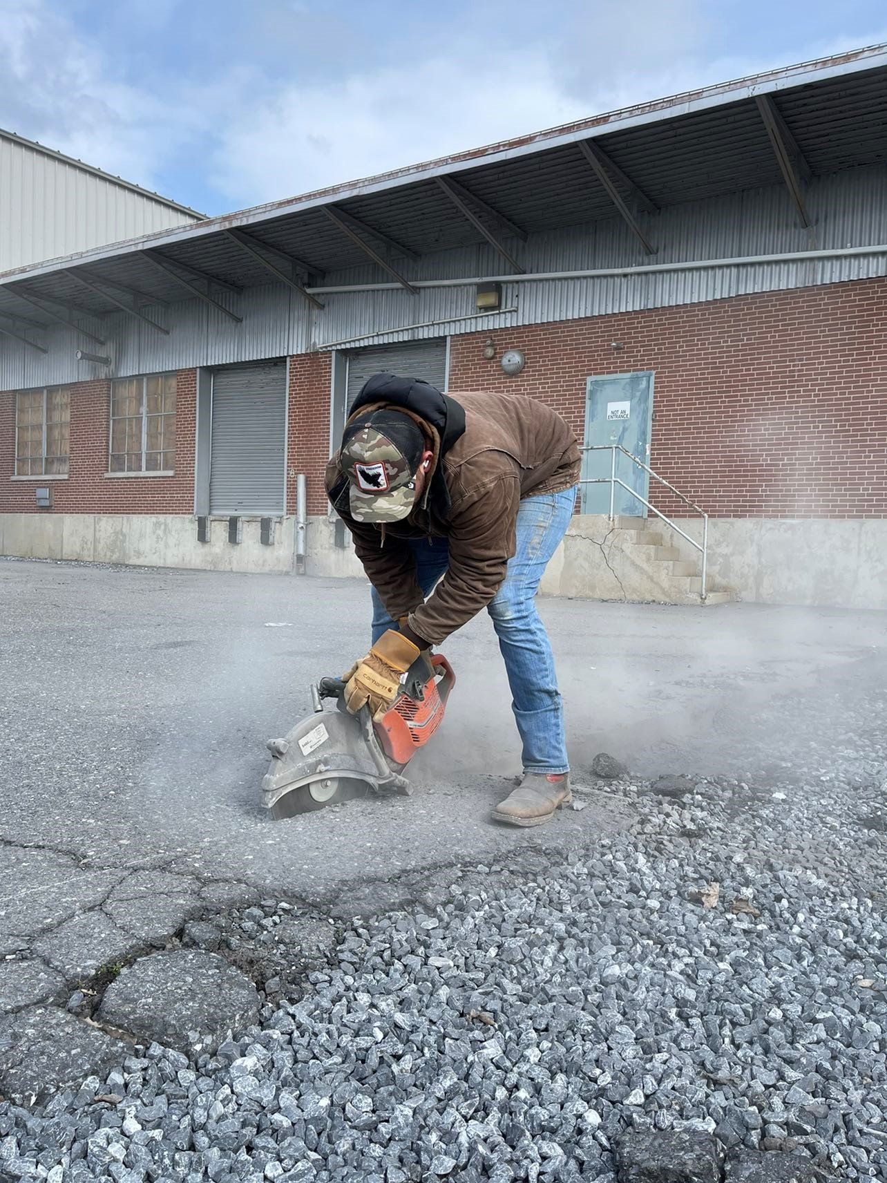 Man Grinding Floor — Bethel, PA — Peterman Bros. Septic Service