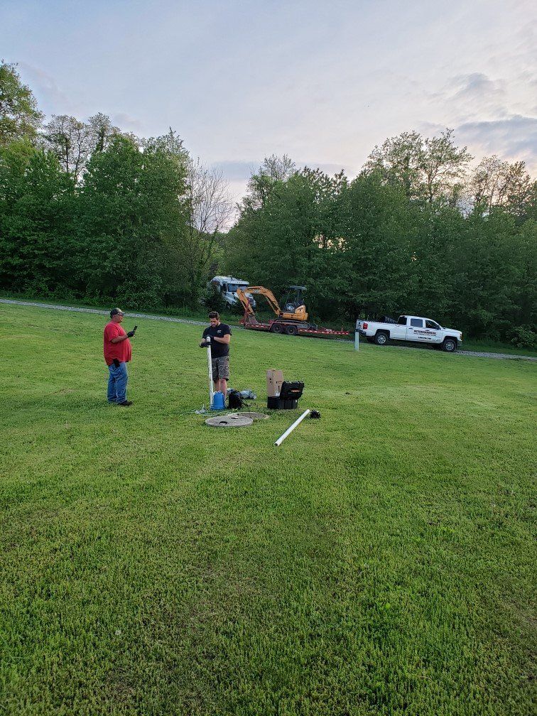 A Couple Of Septic Tank Workers — Bethel, PA — Peterman Bros. Septic Service