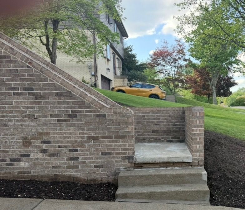 brick staircase wall after pressure washing