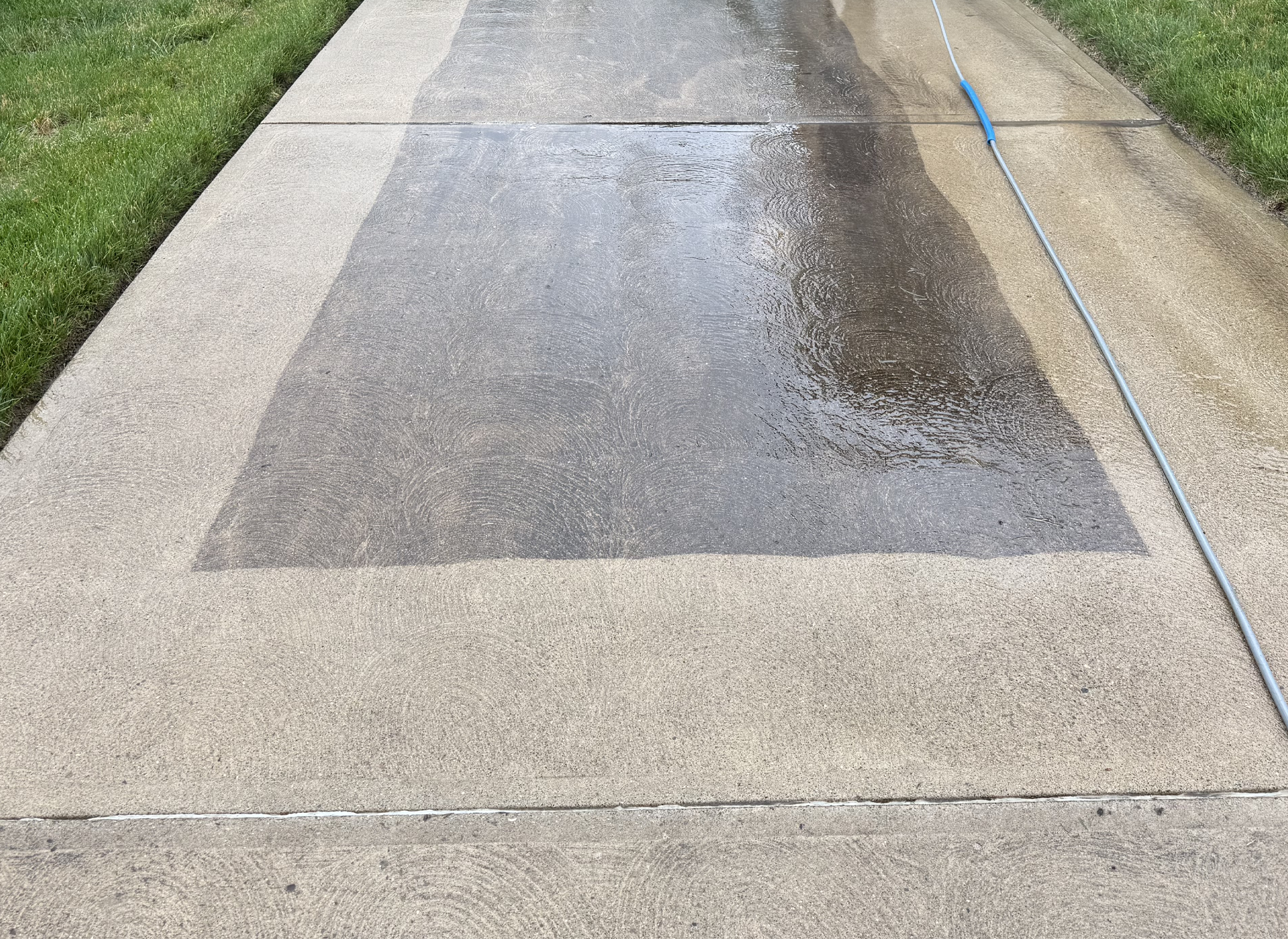 pressure washed concrete sidewalk patch with dirty comparison down the center