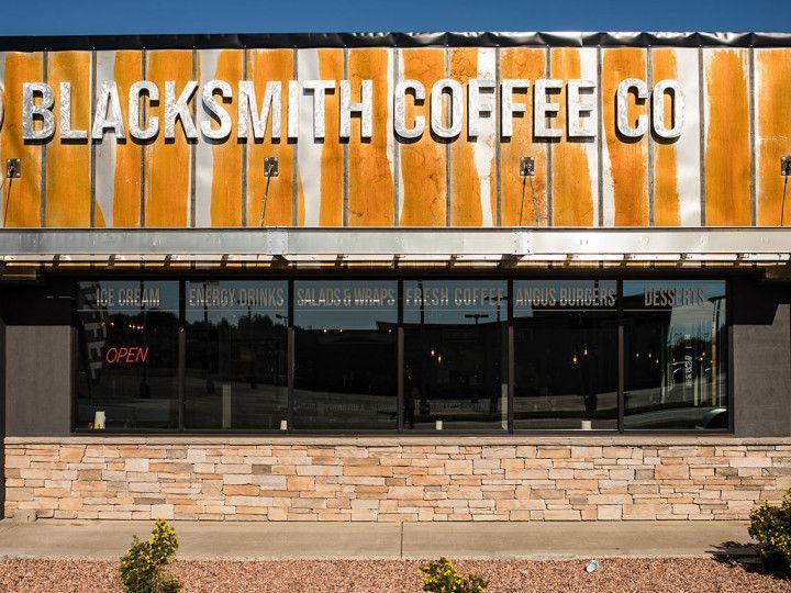 a building with a sign that says blacksmith coffee co