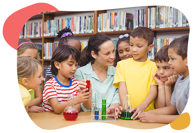 A teacher is teaching a group of children how to do a science experiment.