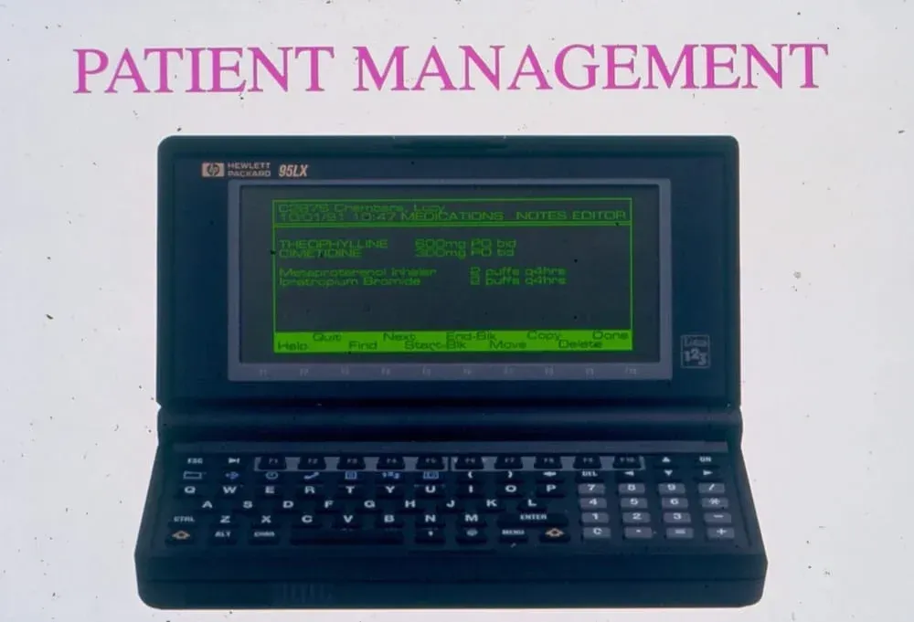 A laptop with a screen that says patient management