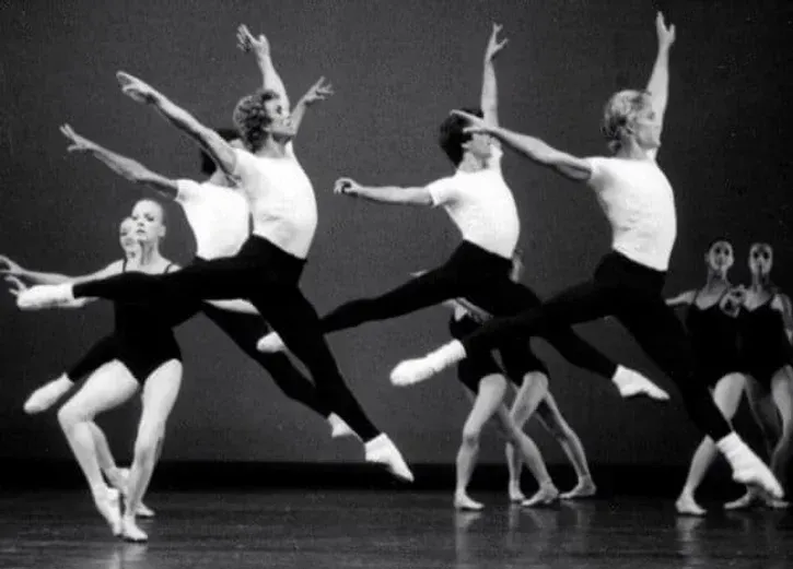 A black and white photo of a group of ballet dancers