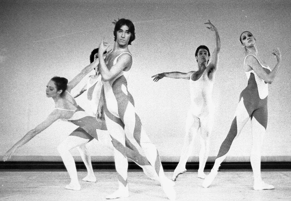 A black and white photo of a group of dancers