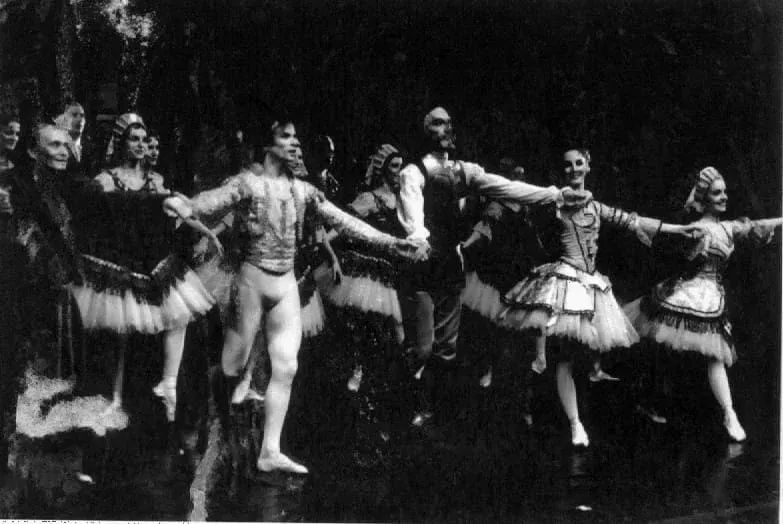 A black and white photo of a group of people dancing