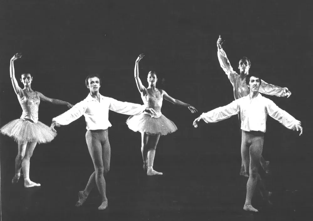 A black and white photo of a group of ballet dancers