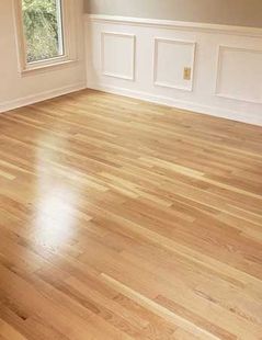 Empty room with light hardwood floors