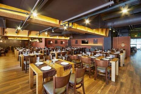 A large dining room filled with tables and chairs.