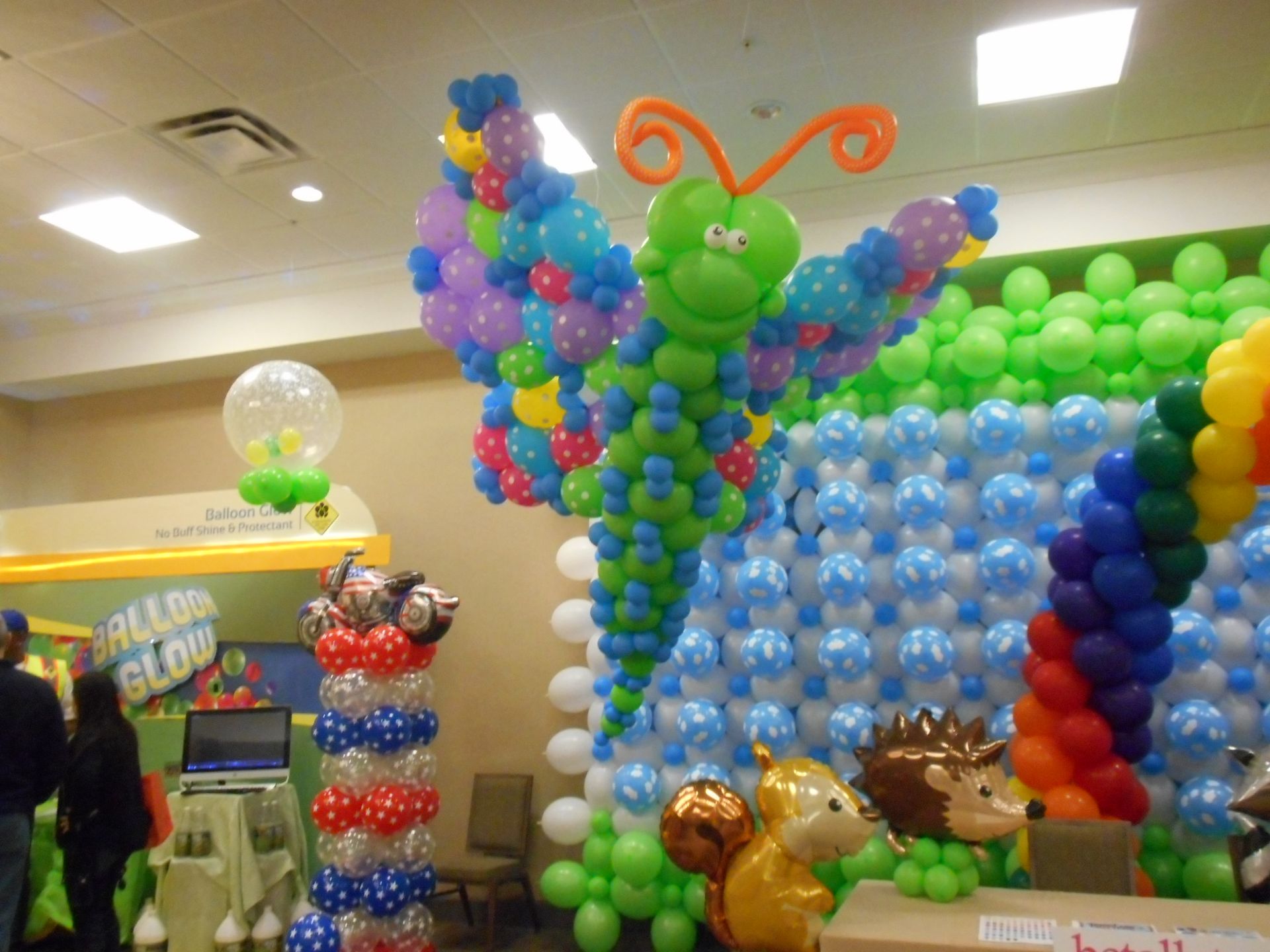A butterfly made out of balloons in a room