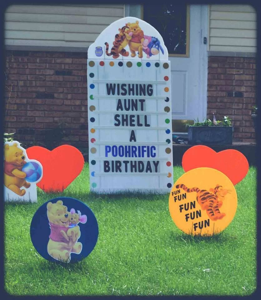 A sign that says wishing aunt shell a poohrific birthday.  