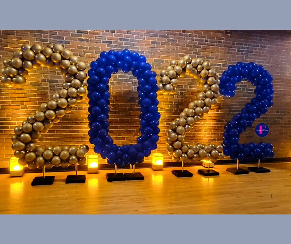 The number 2022 is made of blue and gold balloons