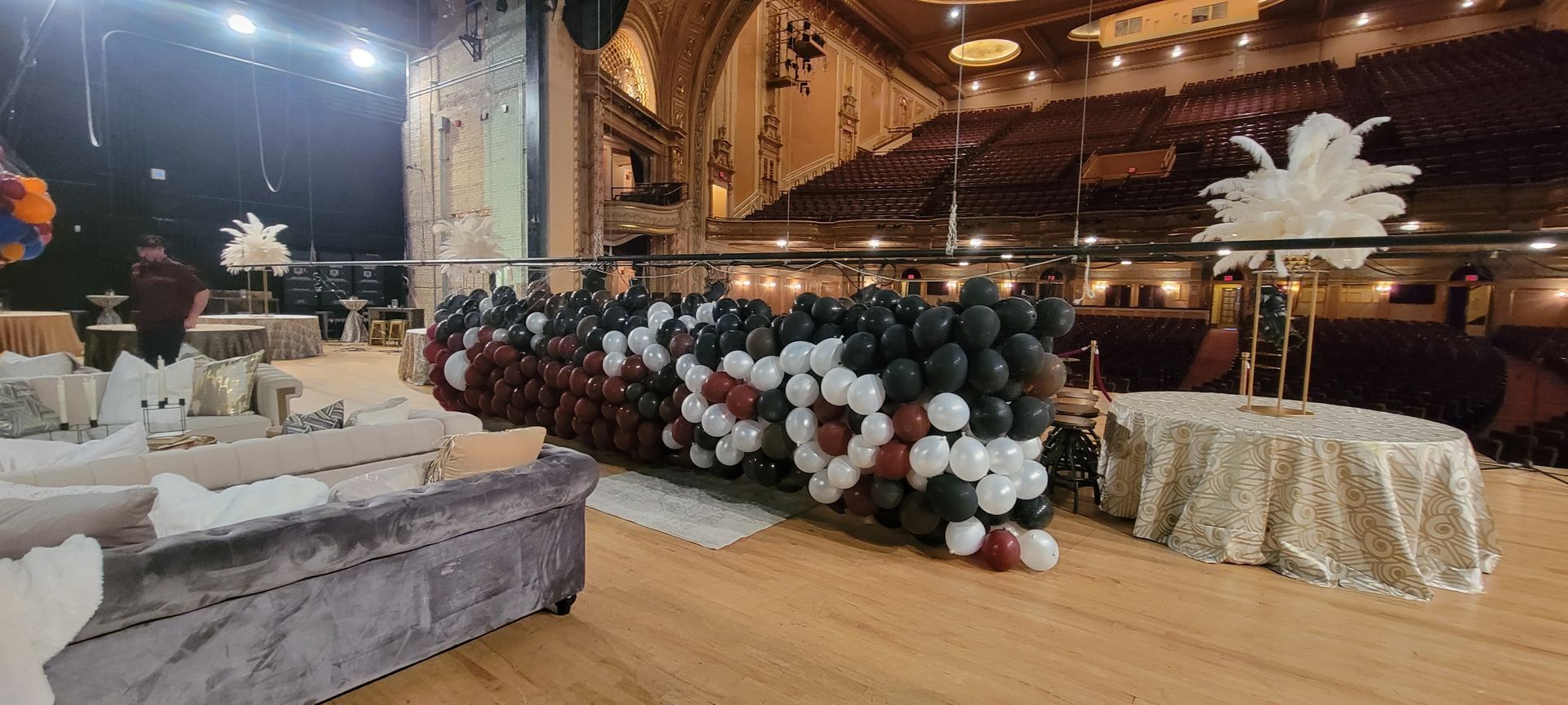 Balloon drop being prepped by Fun By The yard at the Morris Civic in South Bend.  Maroon white and black balloons