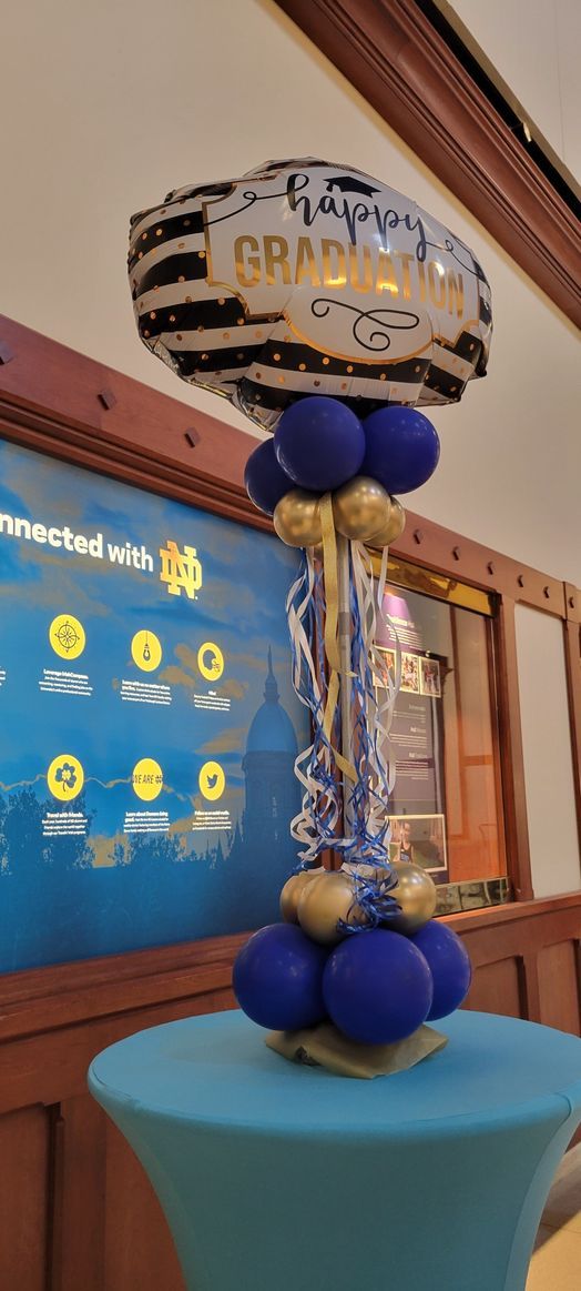 A bunch of balloons are sitting on top of a table.