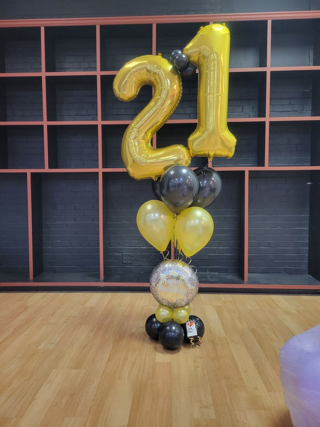 Helium Balloon Bouquet with the number 21 on them