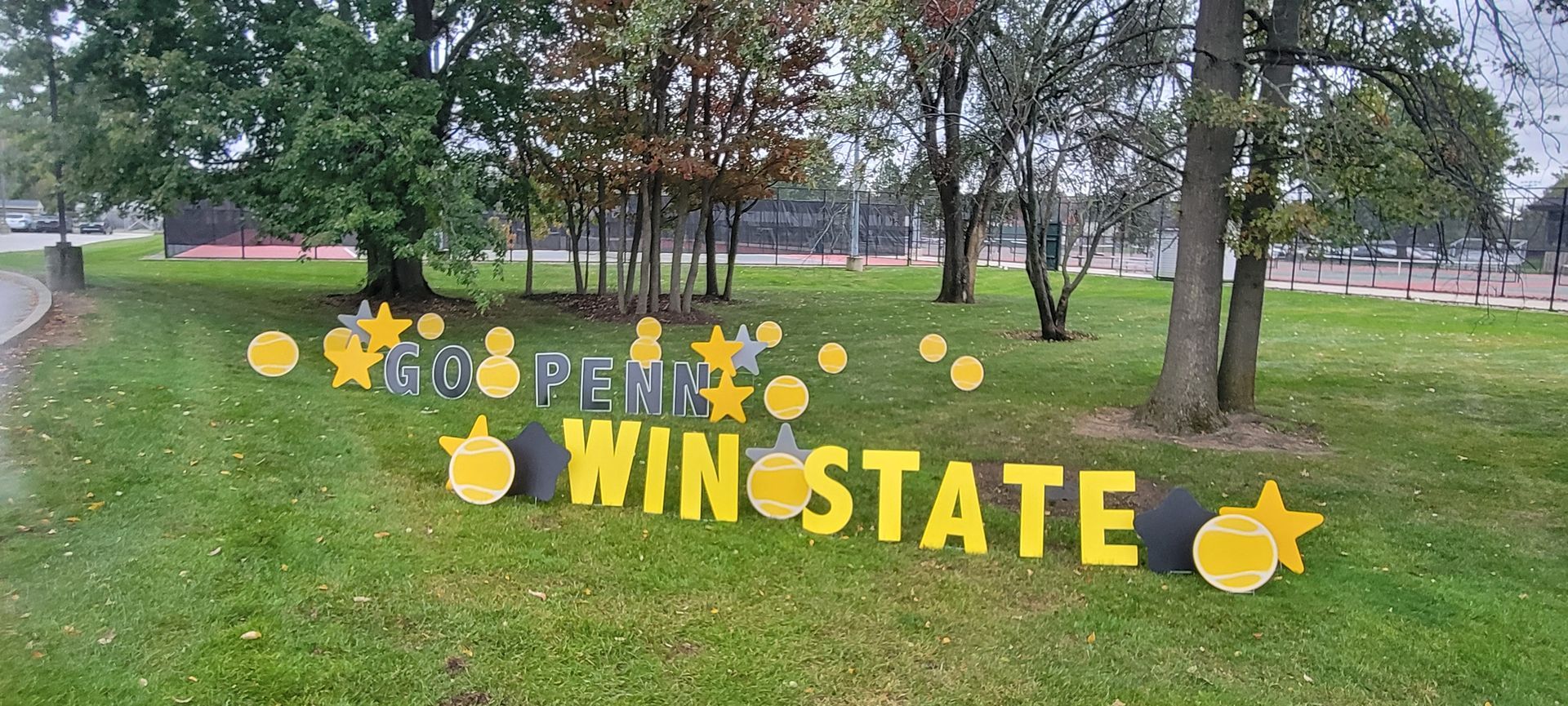 Sign on grass reads 