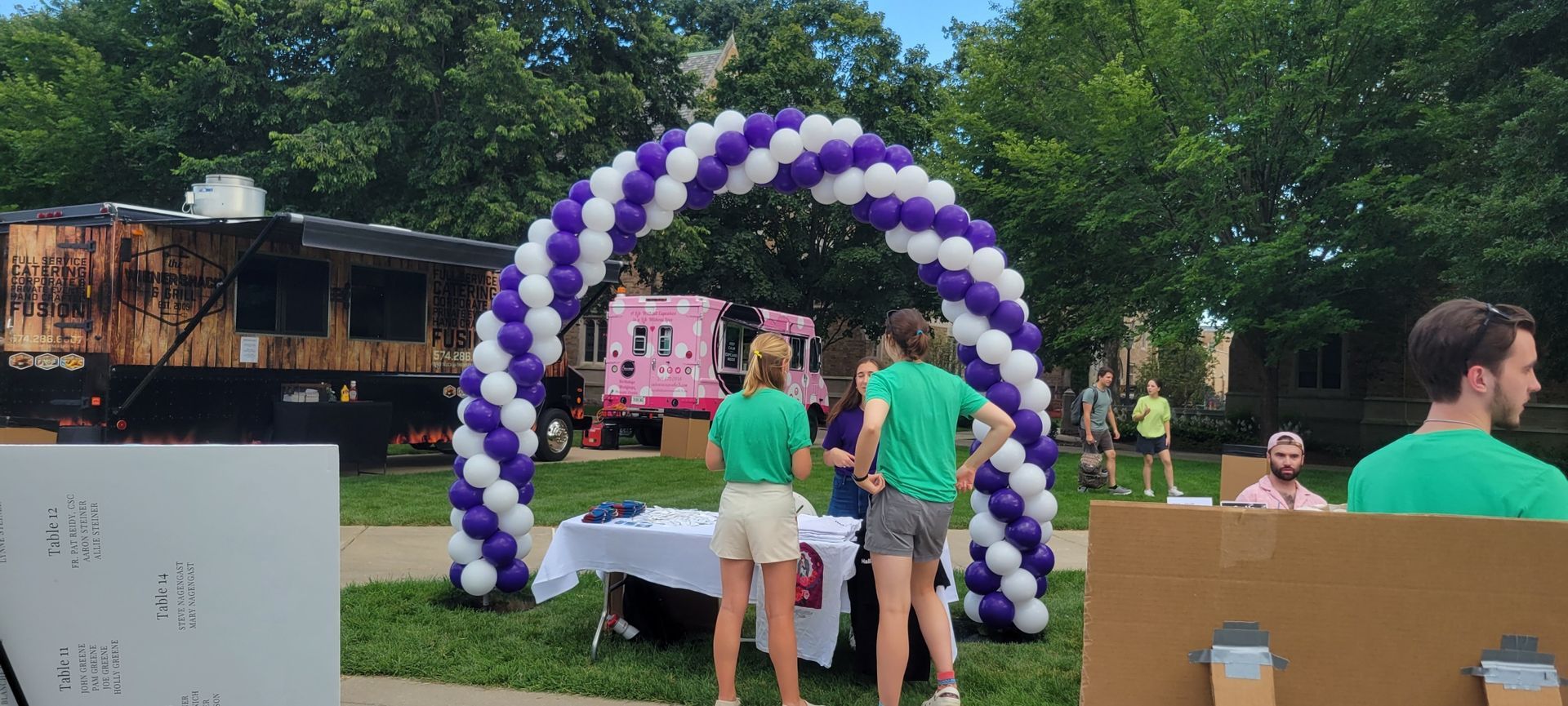classic balloon arch in purple and white at notre dame university