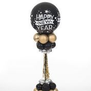 A black and gold happy new year balloon on a stick.